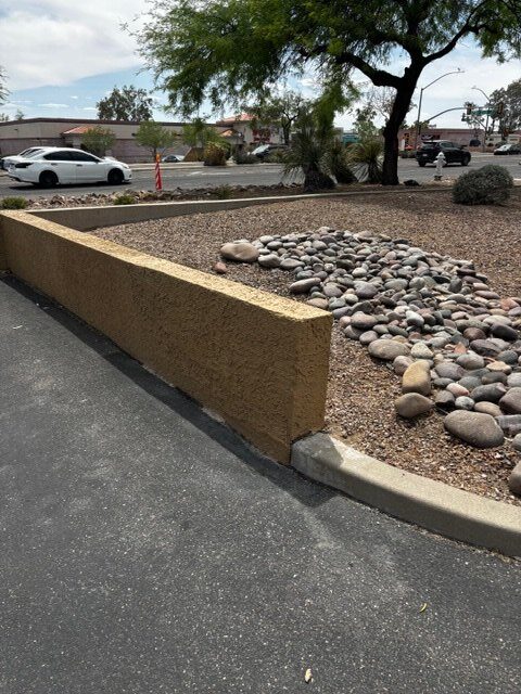 Commercial exterior stucco wall after repair and re-texturing